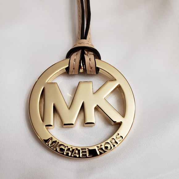 Michael Kors Handbags - Michael Kors logo charm/medallion